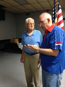 Shipmate George Liset receiving his 45 year continuous membership pin in the FRA from Shipmate Mark Rogers at the monthly meeting on 1 4 July 2015