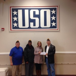 (L-R) SHIPMATE'S BLIZARD AND APPLEWHITE, AMY LEUSCHKE OF THE USO AND SHIPMATE ROGERS PRESENT A CHECK FOR $300.00 ON 9 DECEMBER